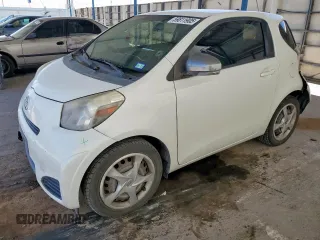 2012 Scion iQ with VIN JTNJJXB06CJ016382, listed as a Copart auction lot 59811905 with 115,911 mi miles and Salvage title. Bid and sale history available at DreamBid. Image 1.