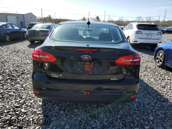 2018 Ford Focus SE with VIN 1FADP3FE9JL306394, listed as a Copart auction lot 52902175 with 77,338 mi miles and Salvage title. Bid and sale history available at DreamBid. Image 6.