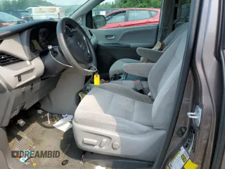 2016 Toyota Sienna LE with VIN 5TDJK3DC3GS134674, listed as a Copart auction lot 67357104 with 105,079 mi miles and Salvage Title. Bid and sale history available at carsss.com. Image 7.