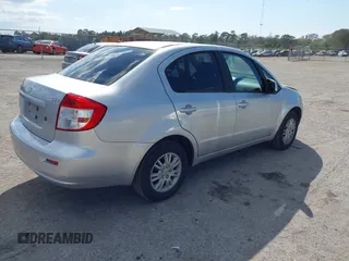 2012 Suzuki SX4 LE with VIN JS2YC5A30C6304324, listed as a IAAI auction lot 41585174 with 111,471 mi miles. Bid and sale history available at carsss.com. Image 4.