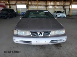 1995 Mercury Cougar z VIN 1MELM62W2SH613956, wystawiony jako Copart lot #49742425 z przebiegiem 94 806 mil mil oraz Tytuł czysty. Historia ofert i sprzedaży dostępna na DreamBid. Obrazek 5.