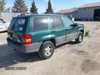 1997 Jeep Grand Cherokee Laredo with VIN 1J4GZ58S2VC595442, listed as a IAAI auction lot 41772133 with 229,764 mi miles. Bid and sale history available at carsss.com. Image 4.