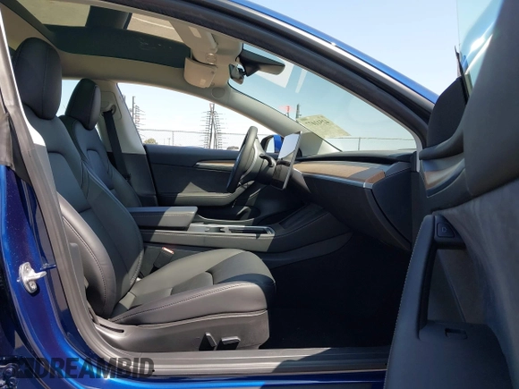 2023 Tesla Model 3 z VIN 5YJ3E1EA6PF547209, wystawiony jako IAAI lot #42511077 z przebiegiem 6 125 mil mil oraz . Historia ofert i sprzedaży dostępna na DreamBid. Obrazek 5.