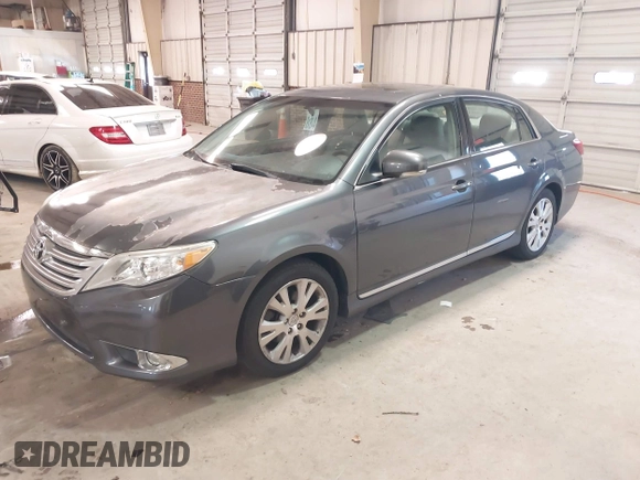 2011 Toyota Avalon with VIN 4T1BK3DB6BU432597, listed as a IAAI auction lot 41625819 with 233,536 mi miles and . Bid and sale history available at DreamBid. Image 2.