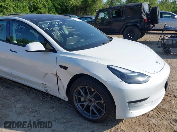 2023 Tesla Model 3 with VIN 5YJ3E1EA3PF617460, listed as a IAAI auction lot 42154401 with 9,578 mi miles and . Bid and sale history available at DreamBid. Image 6.