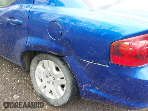 2013 Dodge Avenger SE with VIN 1C3CDZAB4DN628596, listed as a IAAI auction lot 41904599 with 56,791 mi miles and . Bid and sale history available at DreamBid. Image 12.