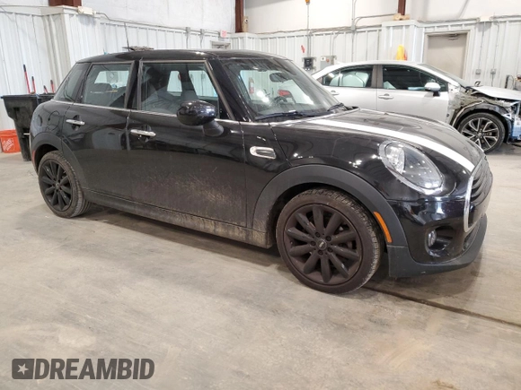 2021 MINI Hardtop 4 Door Oxford Edition with VIN WMWXU7C00M2N49230, listed as a Copart auction lot 77797914 with 51,877 mi miles and Salvage title. Bid and sale history available at DreamBid. Image 4.