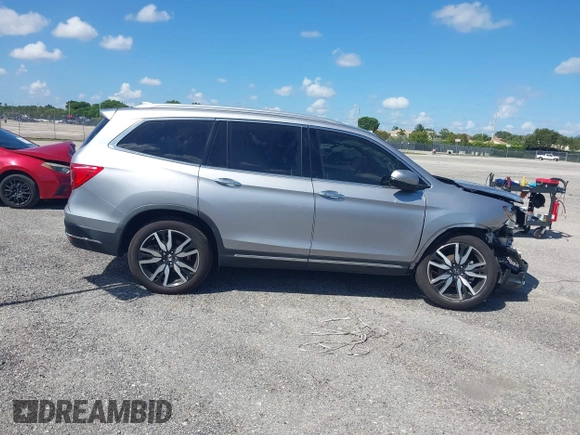 2021 Honda Pilot Touring 8-Passenger with VIN 5FNYF5H99MB041638, listed as a IAAI auction lot 42112915 with 33,230 mi miles and . Bid and sale history available at DreamBid. Image 13.