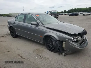 2003 Jaguar X-Type z VIN SAJEB52D33XD54978, wystawiony jako Copart lot #58027805 z przebiegiem Nie podano mil oraz Szkoda całkowita • Salvage title. Historia ofert i sprzedaży dostępna na DreamBid. Obrazek 4.
