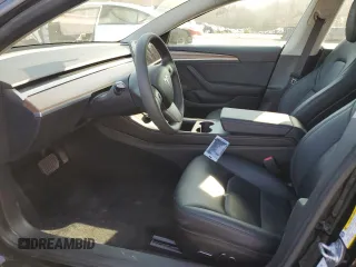 2023 Tesla Model 3 with VIN 5YJ3E1EA3PF670787, listed as a Copart auction lot 49070865 with 13,489 mi miles and Salvage title. Bid and sale history available at DreamBid. Image 7.