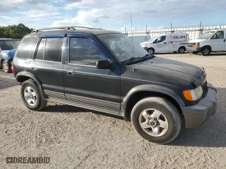 2002 Kia Sportage with VIN KNDJB723625167905, listed as a Copart auction lot 74193854 with 98,864 mi miles and Salvage Title. Bid and sale history available at carsss.com. Image 4.