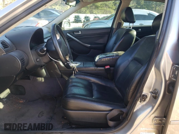 2003 Infiniti G35 w/Leather with VIN JNKCV51E83M016075, listed as a Copart auction lot 84657544 with 196,858 mi miles and Salvage Title. Bid and sale history available at DreamBid. Image 7.