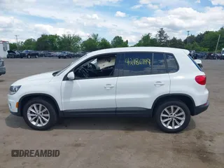 2014 Volkswagen Tiguan S with VIN WVGBV3AX0EW589381, listed as a IAAI auction lot 42186999 with 144,137 mi miles and . Bid and sale history available at DreamBid. Image 14.