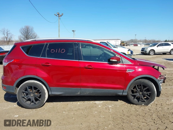 2016 Ford Escape Titanium with VIN 1FMCU9J98GUB42453, listed as a IAAI auction lot 41760110 with 116,452 mi miles. Bid and sale history available at carsss.com. Image 14.