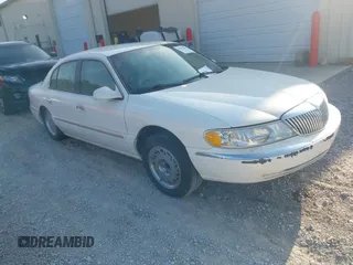 1998 Lincoln Continental z VIN 1LNLM97V1WY602564, wystawiony jako IAAI lot #42333637 z przebiegiem 142 234 mil mil oraz . Historia ofert i sprzedaży dostępna na DreamBid. Obrazek 1.