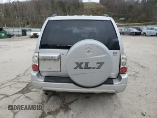 2005 Suzuki XL7 LX z VIN JS3TX92V654108114, wystawiony jako Copart lot #81158564 z przebiegiem 130 384 mil mil oraz Szkoda całkowita • Salvage title. Historia ofert i sprzedaży dostępna na DreamBid. Obrazek 6.