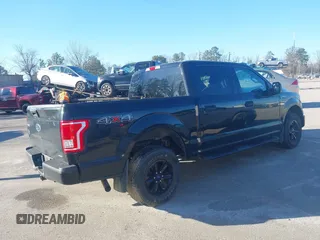 2015 Ford F-150 XLT with VIN 1FTEW1E86FFC00959, listed as a IAAI auction lot 41581711 with 130,298 mi miles. Bid and sale history available at carsss.com. Image 4.