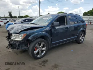 2013 Dodge Journey American Value with VIN 3C4PDCAB7DT680055, listed as a Copart auction lot 58241435 with 199,620 mi miles and Salvage title. Bid and sale history available at DreamBid. Image 1.