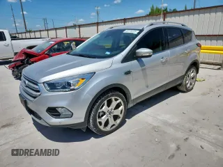 2019 Ford Escape Titanium z VIN 1FMCU0J98KUB34633, wystawiony jako Copart lot #66278205 z przebiegiem 93 333 mil mil oraz Czysty tytuł • Clean title. Historia ofert i sprzedaży dostępna na DreamBid. Obrazek 1.