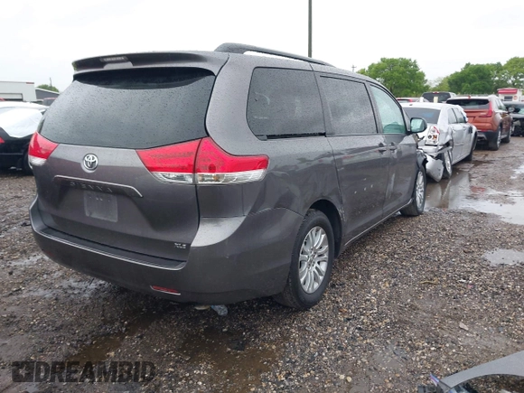2014 Toyota Sienna XLE with VIN 5TDYK3DC0ES502482, listed as a IAAI auction lot 41910683 with 151,330 mi miles. Bid and sale history available at carsss.com. Image 4.