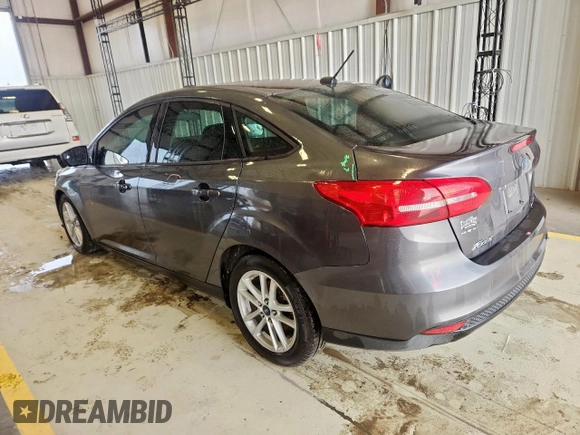 2018 Ford Focus SE with VIN 1FADP3FE0JL311760, listed as a Copart auction lot 63621755 with 81,000 mi miles and Salvage title. Bid and sale history available at DreamBid. Image 2.