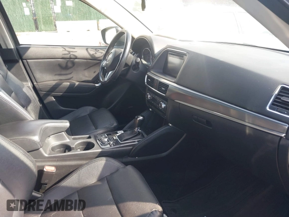 2016 Mazda CX-5 Grand Touring with VIN JM3KE4DY5G0681436, listed as a IAAI auction lot 41664780 with 172,199 mi miles. Bid and sale history available at carsss.com. Image 5.