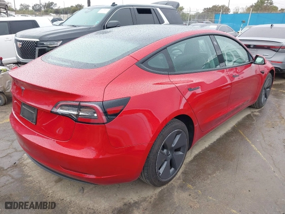 2023 Tesla Model 3 with VIN 5YJ3E1EA2PF476140, listed as a IAAI auction lot 41789189 with 33,435 mi miles. Bid and sale history available at carsss.com. Image 4.