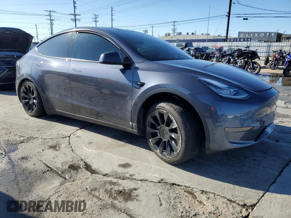 2023 Tesla Model Y Long Range with VIN 7SAYGDEE2PA047794, listed as a Copart auction lot 48397305 with 18,850 mi miles and Salvage Title. Bid and sale history available at DreamBid. Image 4.