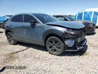 2023 Mazda CX-30 S Carbon Edition z VIN 3MVDMBCM2PM524384, wystawiony jako Copart lot #62699155 z przebiegiem 25 765 mil mil oraz Szkoda całkowita • Salvage title. Historia ofert i sprzedaży dostępna na DreamBid. Obrazek 4.