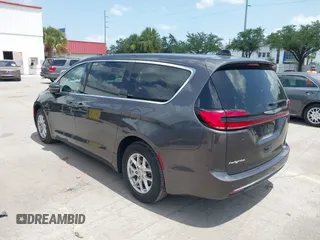 2023 Chrysler Pacifica Touring L with VIN 2C4RC1BG6PR590302, listed as a IAAI auction lot 42451369 with 72,097 mi miles and . Bid and sale history available at DreamBid. Image 3.