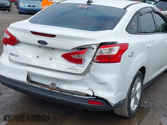 2013 Ford Focus SE z VIN 1FADP3F29DL372289, wystawiony jako IAAI lot #42364286 z przebiegiem 201 091 mil mil oraz . Historia ofert i sprzedaży dostępna na DreamBid. Obrazek 6.