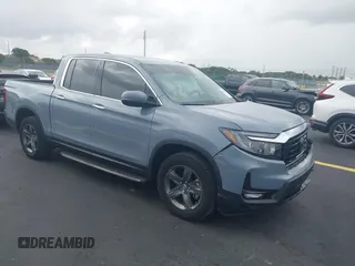 2023 Honda Ridgeline RTL-E with VIN 5FPYK3F7XPB065203, listed as a IAAI auction lot 42484647 with 10,981 mi miles and . Bid and sale history available at DreamBid. Image 1.
