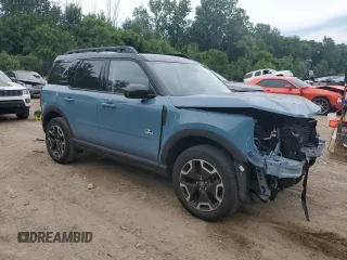 2022 Ford Bronco Sport Outer Banks z VIN 3FMCR9C61NRD00690, wystawiony jako Copart lot #61822235 z przebiegiem 10 635 mil mil oraz Czysty tytuł • Clean title. Historia ofert i sprzedaży dostępna na DreamBid. Obrazek 4.