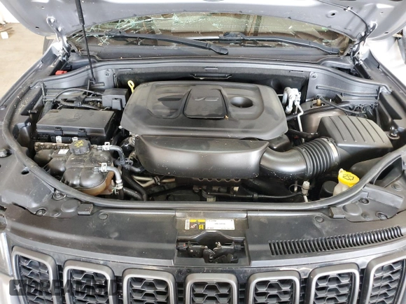 2021 Jeep Grand Cherokee Trailhawk z VIN 1C4RJFLG9MC502171, wystawiony jako Copart lot #59328045 z przebiegiem 154 012 mil mil oraz Szkoda całkowita • Salvage title. Historia ofert i sprzedaży dostępna na DreamBid. Obrazek 11.