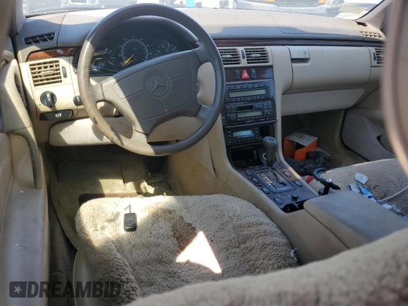 1997 Mercedes-Benz E-Class with VIN WDBJF72F2VA274233, listed as a Copart auction lot 74123554 with 80,914 mi miles and Salvage Title. Bid and sale history available at carsss.com. Image 8.