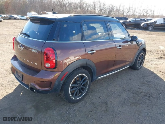 2015 MINI Cooper Countryman S with VIN WMWZC5C55FWP47826, listed as a IAAI auction lot 41342674 with 94,683 mi miles. Bid and sale history available at carsss.com. Image 4.