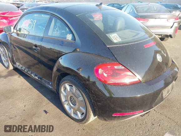2012 Volkswagen Beetle 2.5L w/Sound/Nav PZEV with VIN 3VWJP7AT7CM661055, listed as a IAAI auction lot 41980159 with 113,678 mi miles and . Bid and sale history available at DreamBid. Image 3.