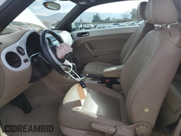 2015 Volkswagen Beetle 1.8T with VIN 3VW517AT6FM802771, listed as a Copart auction lot 72225834 with 128,946 mi miles and Salvage title. Bid and sale history available at DreamBid. Image 7.