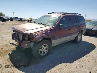 2000 Jeep Grand Cherokee Laredo z VIN 1J4GW48S4YC371998, wystawiony jako Copart lot #54183685 z przebiegiem 326 917 mil mil oraz Szkoda całkowita • Salvage title. Historia ofert i sprzedaży dostępna na DreamBid. Obrazek 1.