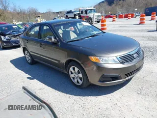 2009 Kia Optima LX with VIN KNAGE228095327297, listed as a IAAI auction lot 41895638 with 170,024 mi miles. Bid and sale history available at carsss.com. Image 1.