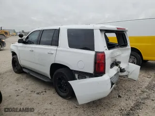 2020 Chevrolet Tahoe Commercial with VIN 1GNLCDEC6LR164083, listed as a Copart auction lot 76721974 with 76,005 mi miles and Salvage Title. Bid and sale history available at carsss.com. Image 2.