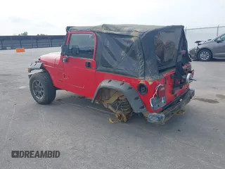 2001 Jeep Wrangler Sport z VIN 1J4FA49S31P335680, wystawiony jako IAAI lot #42471312 z przebiegiem 212 927 mil mil oraz . Historia ofert i sprzedaży dostępna na DreamBid. Obrazek 3.