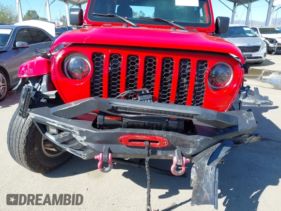 2022 Jeep Gladiator Willys Sport z VIN 1C6HJTAG0NL180848, wystawiony jako IAAI lot #41778129 z przebiegiem Nie podano mil oraz . Historia ofert i sprzedaży dostępna na DreamBid. Obrazek 19.