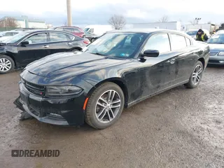 2019 Dodge Charger SXT with VIN 2C3CDXJG3KH630975, listed as a IAAI auction lot 41580174 with 74,575 mi miles and . Bid and sale history available at DreamBid. Image 17.