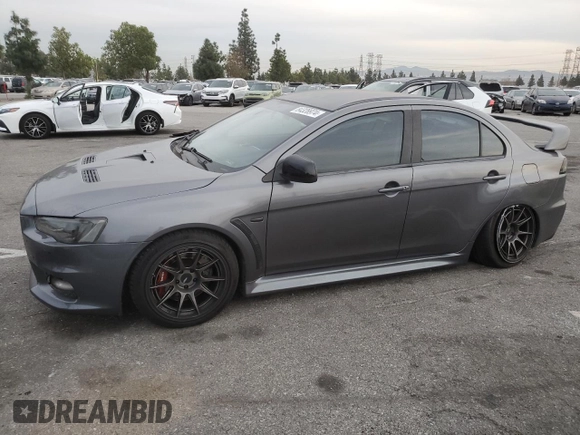 2010 Mitsubishi Lancer Evolution GSR with VIN JA32W8FV1AU027600, listed as a Copart auction lot 84328974 with 88,417 mi miles and Salvage Title. Bid and sale history available at DreamBid. Image 1.