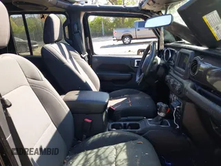 2019 Jeep Wrangler Unlimited Sport S with VIN 1C4HJXDG7KW671598, listed as a IAAI auction lot 42059734 with 63,899 mi miles and . Bid and sale history available at DreamBid. Image 5.