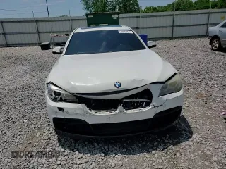 2015 BMW 7 Series 740Li z VIN WBAYE4C5XFD947323, wystawiony jako Copart lot #56962915 z przebiegiem 77 956 mil mil oraz Szkoda całkowita • Salvage title. Historia ofert i sprzedaży dostępna na DreamBid. Obrazek 13.