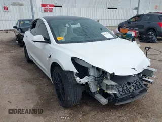 2022 Tesla Model 3 with VIN 5YJ3E1EA9NF337989, listed as a IAAI auction lot 41690465 with 52,842 mi miles. Bid and sale history available at carsss.com. Image 1.