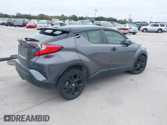 2021 Toyota C-HR LE with VIN JTNKHMBX3M1120177, listed as a IAAI auction lot 41257866 with 43,964 mi miles. Bid and sale history available at carsss.com. Image 4.