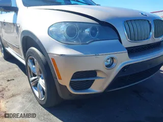 2013 BMW X5 xDrive35i with VIN 5UXZV4C58DL993791, listed as a IAAI auction lot 41631320 with 173,266 mi miles. Bid and sale history available at carsss.com. Image 6.